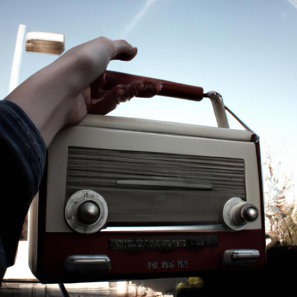 Person holding a vintage radio
