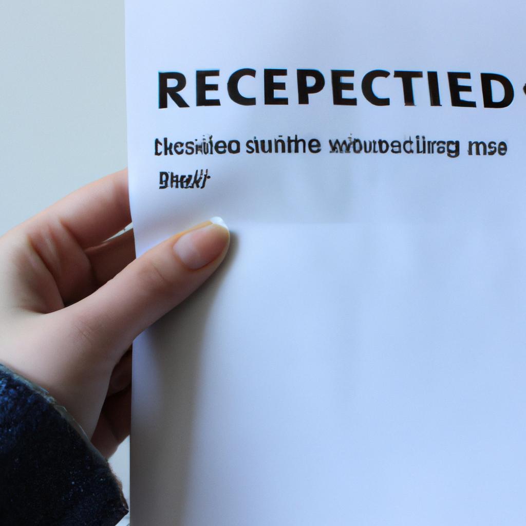 Person holding a rejected application