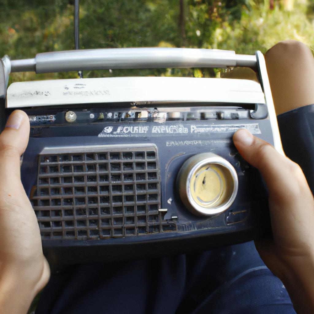 Person holding a radio, reading