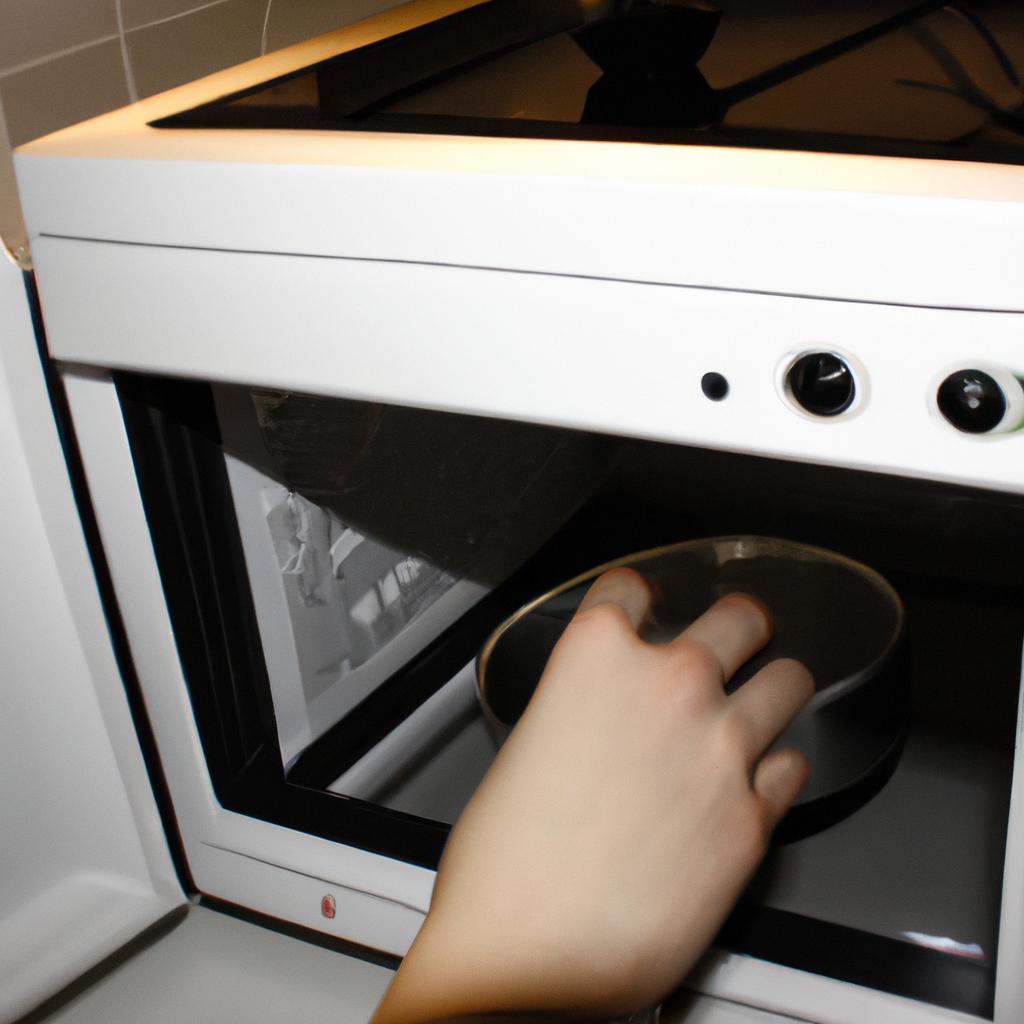 Person operating a microwave oven