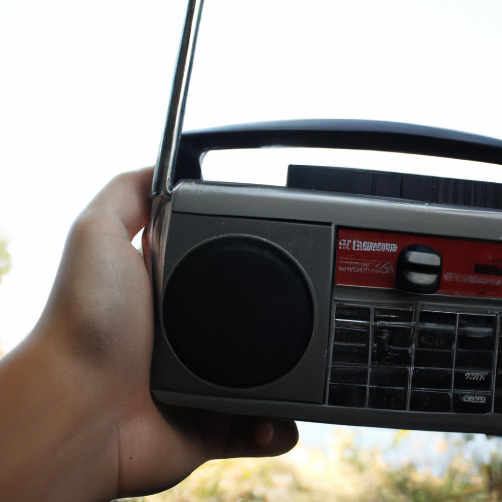 Person holding a radio receiver